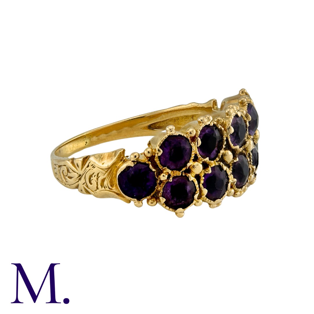 A Two-Row Amethyst Ring in yellow gold, set with twelve amethysts in two rows to an engraved band. - Image 2 of 4
