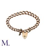 A Large Antique Curb Bracelet in 9K rose gold. Secured with heart-shaped padlock. Marked '375' for