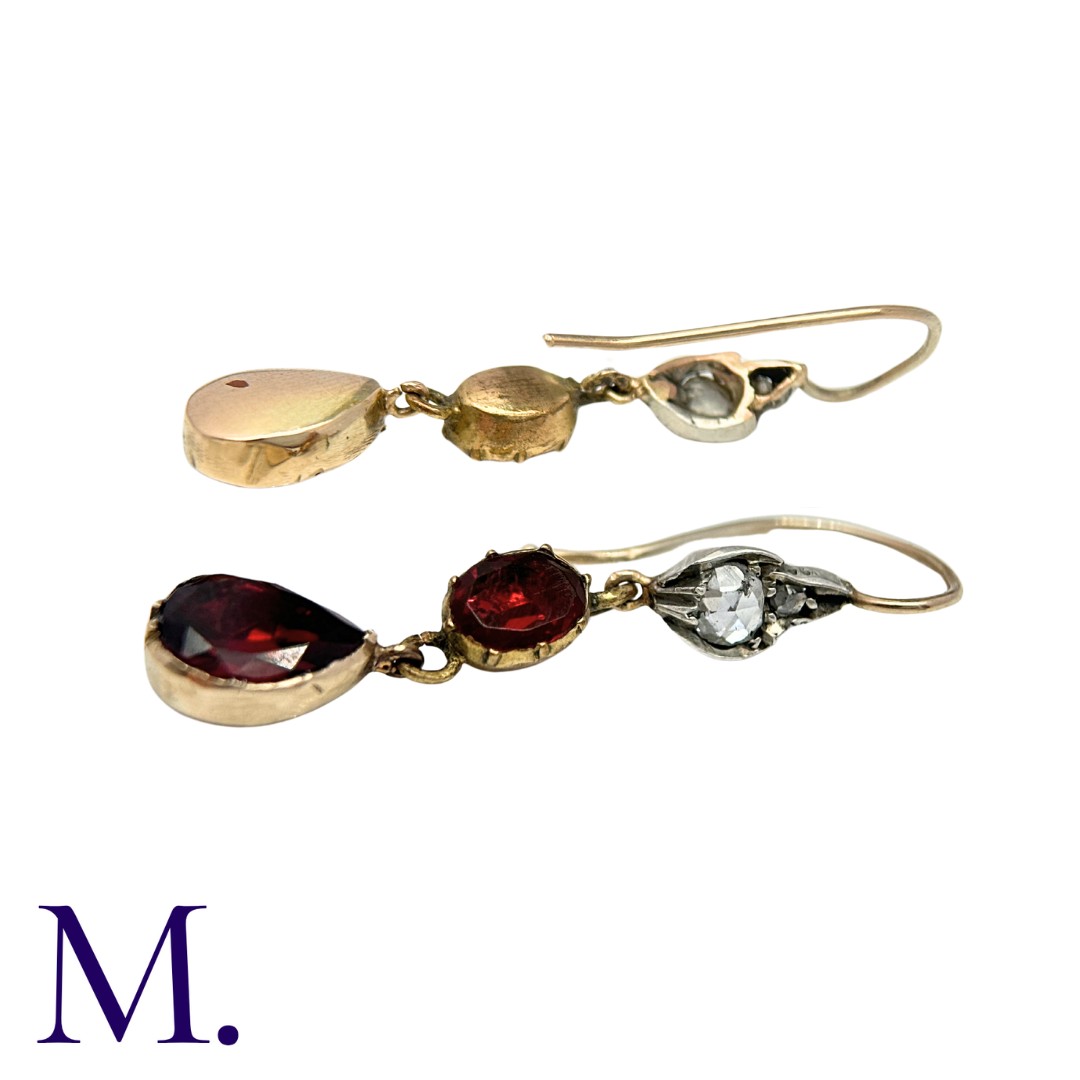A Pair of Antique Garnet and Diamond Earrings set with flat cut garnets and rose diamonds. Size: 4. - Image 2 of 2