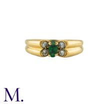 VAN CLEEF & ARPELS. An Emerald and Diamond Butterfly Ring in 18K yellow gold, set with a navette