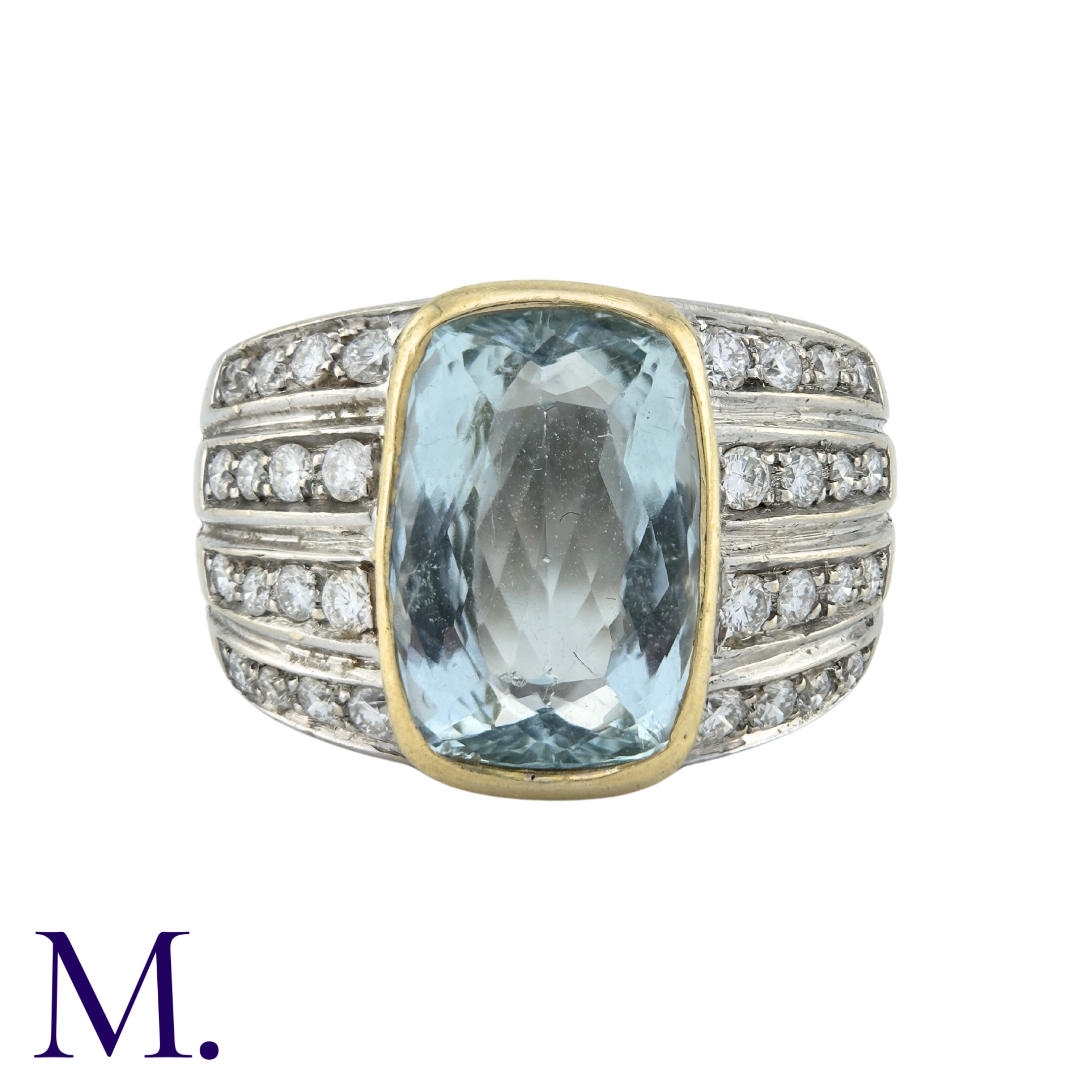 An Aquamarine And Diamond Ring in 18k white and yellow gold, set with a principal aquamarine of