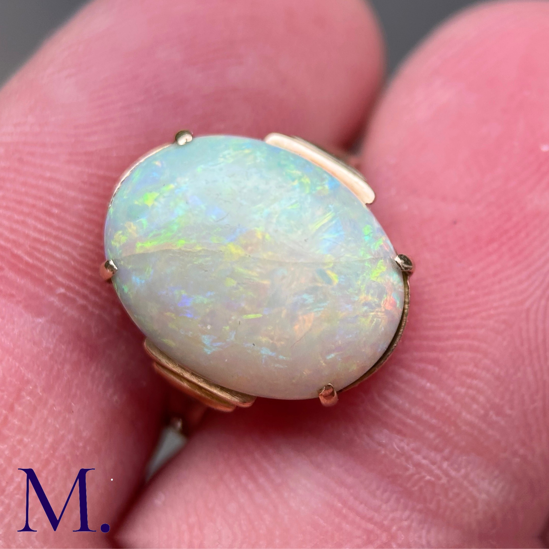 An Opal Ring in 9k yellow gold, set with a cabochon opal to stepped shoulders. Stamped 9ct. Size: - Image 7 of 7