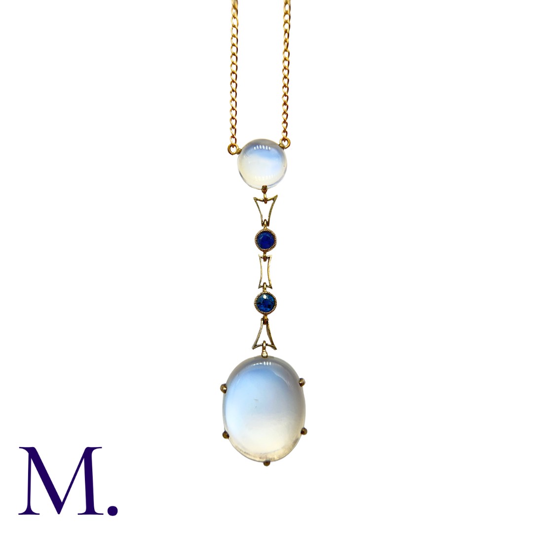 A Moonstone and Sapphire Pendant with Chain in yellow gold, set with an oval cabochon moonstone drop - Image 2 of 2