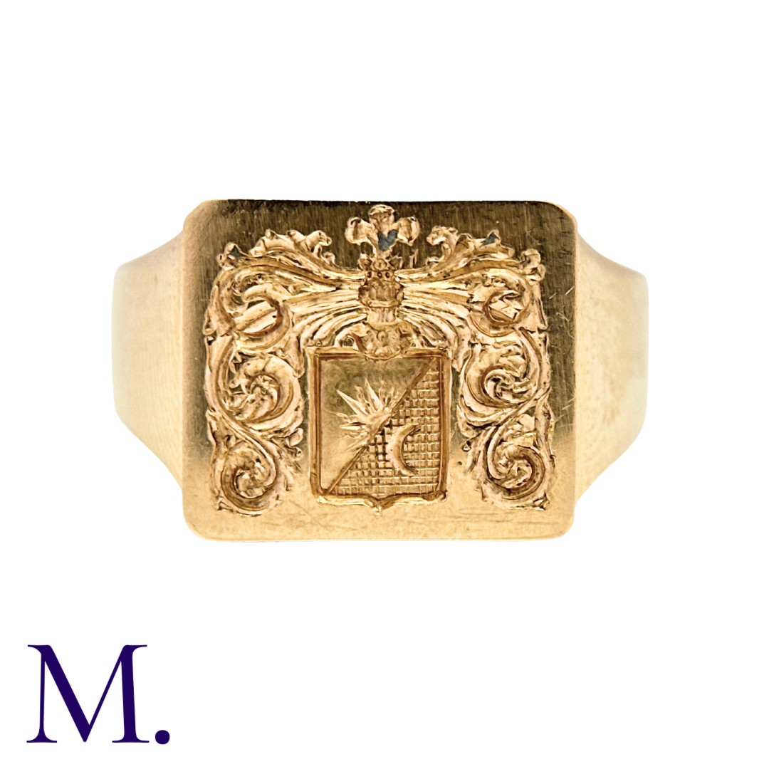 A Gold Signet Ring in 14K yellow gold, with armorial crest to a rectangular face. Marked for 14ct