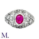 An Antique Ruby and Diamond Bombe Ring in platinum, set with a cabochon ruby (accompanied with a