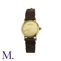 JAEGER-LECOULTRE. A Gold Wristwatch, with brushed Champagne coloured dial and tigers-eye set