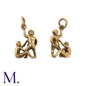 NO RESERVE - Two Gold Charms in 9K yellow gold. One depicting a Winston Churchill head with cigar