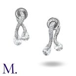 ADLER. A Pair of Diamond Earrings in 18K white gold in two parts - the front and back each in