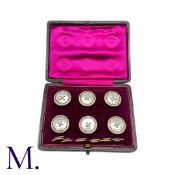 A Mother of Pearl Dress Set in 9K gold, set with mother of pearl and embellished with red enamel.