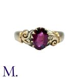 An Antique Garnet Ring in 18K set with an oval-cut garnet (approximately 7x5mm). Hallmarked for 18ct