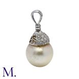 A Diamond and Pearl Drop Pendant in 18K white gold, set with a round cream pearl of approximately