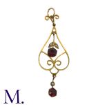 A Garnet and Pearl Pendant in 9K yellow gold, set with two pendant garnets and two seed pearls to an