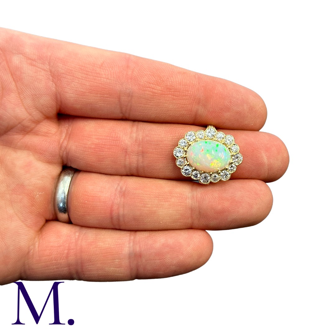 An Opal And Diamond Cluster Ring in 18k yellow gold, set with a principal cabochon opal of - Image 4 of 5