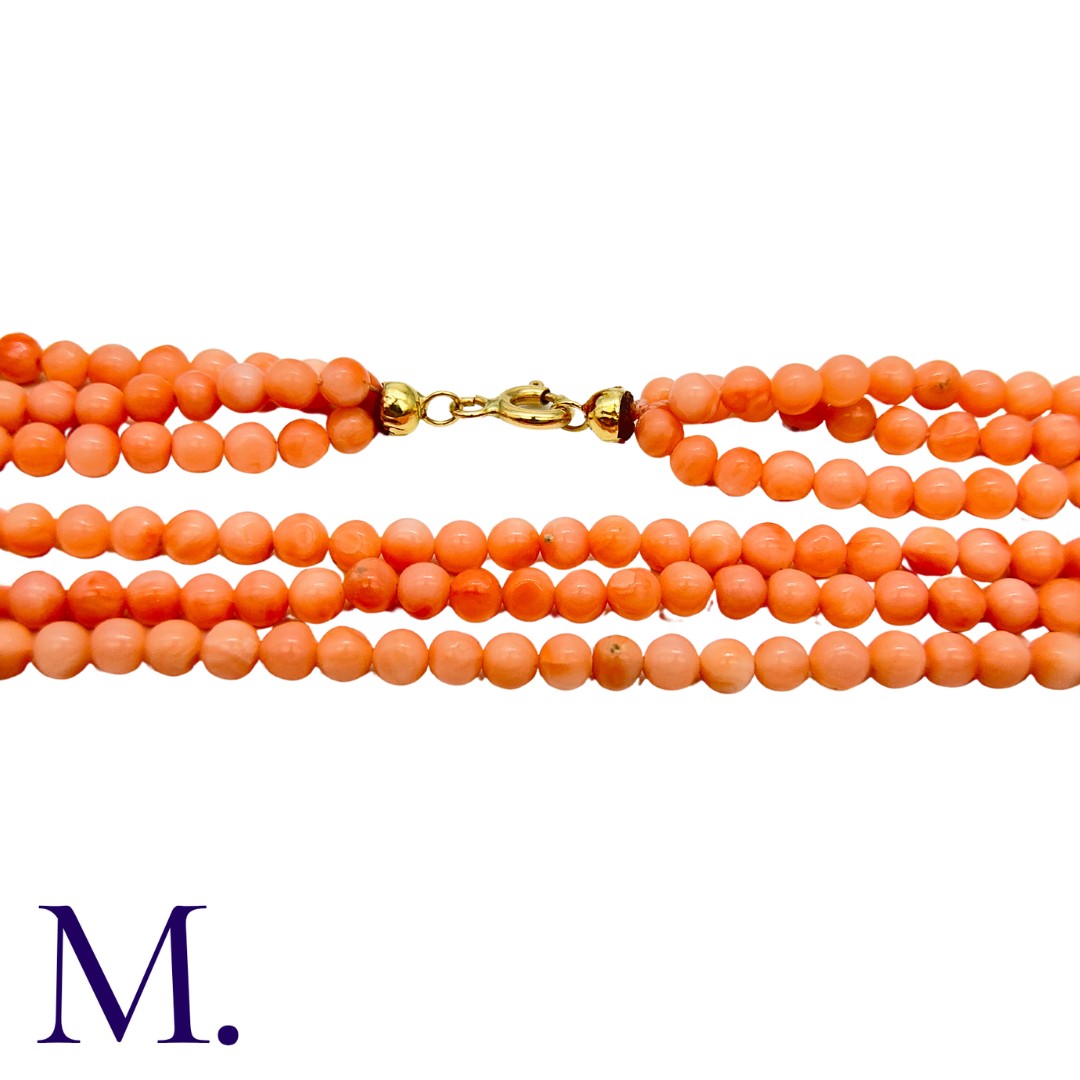 An Angel Skin Coral Necklace in three strands, with 18K clasp. Clasp marked '750'. Size: 55cm - Image 2 of 2