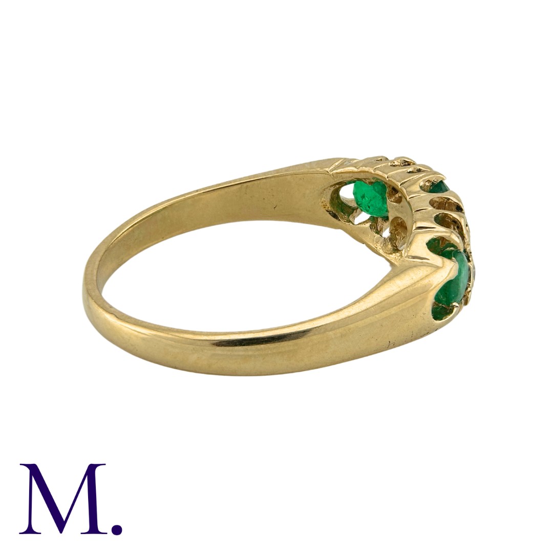 An Emerald And Diamond Ring in 18k yellow gold, set with a principal oval cut emerald, and two round - Image 3 of 3