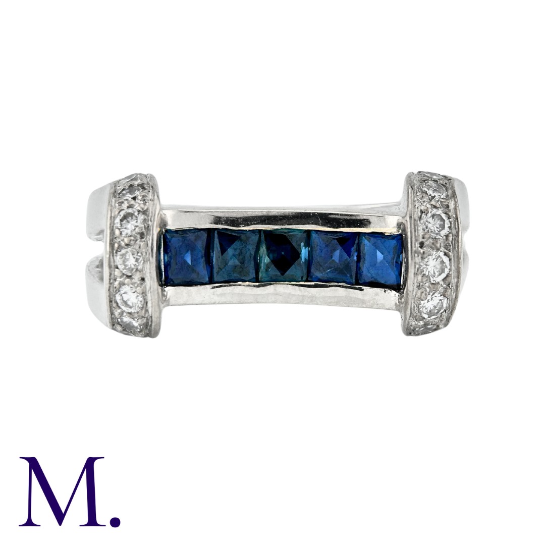 A Sapphire and Diamond Ring in 18K white gold, set with approximately 0.25ct of round cut diamonds