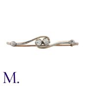 A Diamond Brooch in 18K gold and platinum. Set with four old cut diamonds. Stamped 18CT PT to