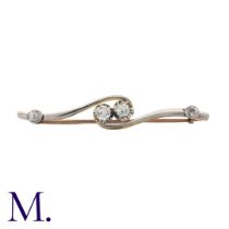 A Diamond Brooch in 18K gold and platinum. Set with four old cut diamonds. Stamped 18CT PT to