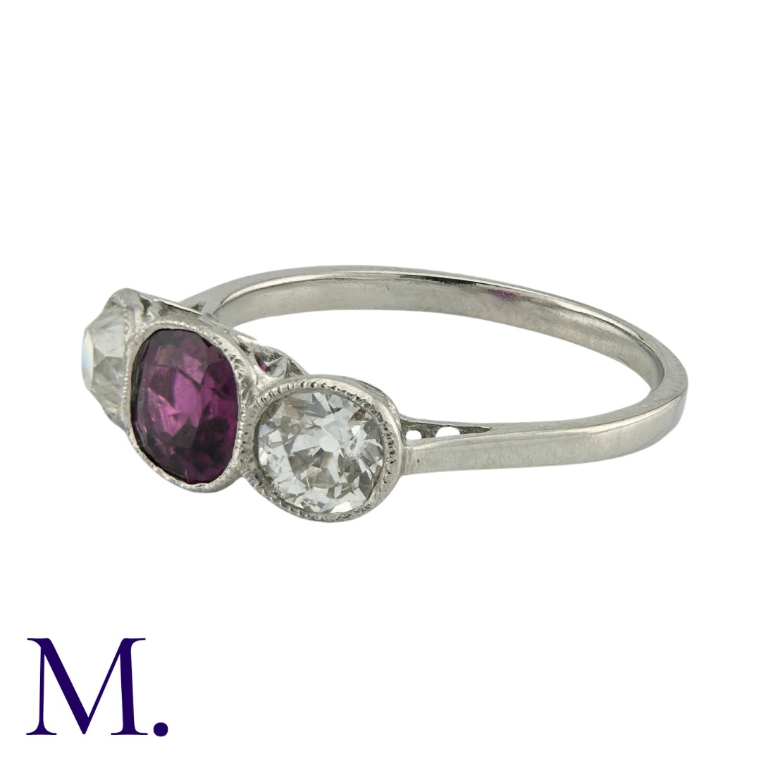 A Ruby And Diamond Three Stone Ring in platinum, set with a principal cushion cut ruby of - Image 3 of 4