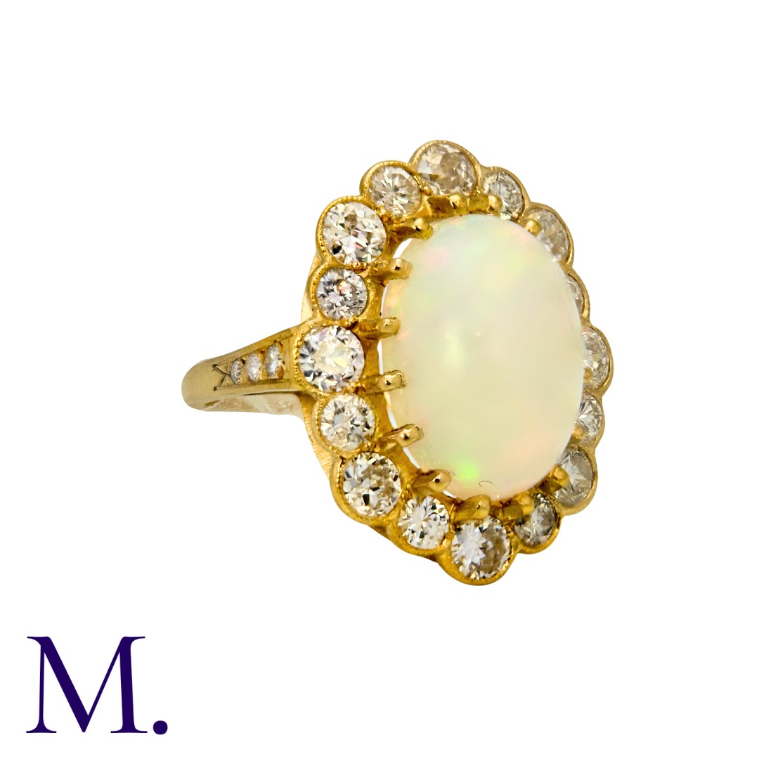 An Opal And Diamond Cluster Ring in 18k yellow gold, set with a principal cabochon opal of - Image 3 of 5