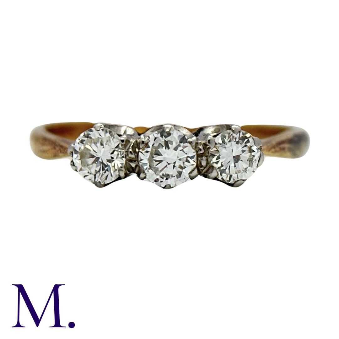 A 3-Stone Diamond Ring in yellow gold and platinum. Set with three round brilliant cut diamonds