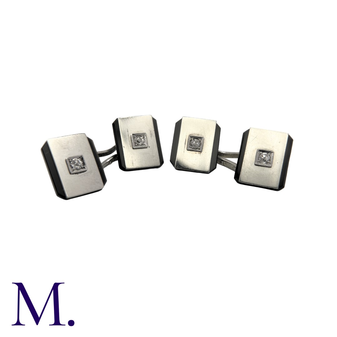 A Pair of Onyx And Diamond Cufflinks in platinum, each set with a diamond weighing approximately 0. - Image 2 of 2