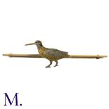 An Enamel Bird Stick Pin in 15k yellow gold, comprising a three colour gold bird on a bar, with