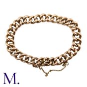 A Gold Curb Bracelet in 9K rose gold, with integrated fastening and safety chain. Size: 21cm Weight: