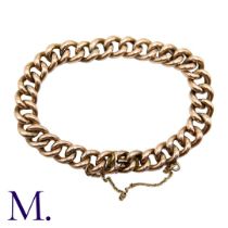 A Gold Curb Bracelet in 9K rose gold, with integrated fastening and safety chain. Size: 21cm Weight: