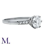 A Diamond Ring in white gold, set with a round brilliant cut diamond to the centre weighing