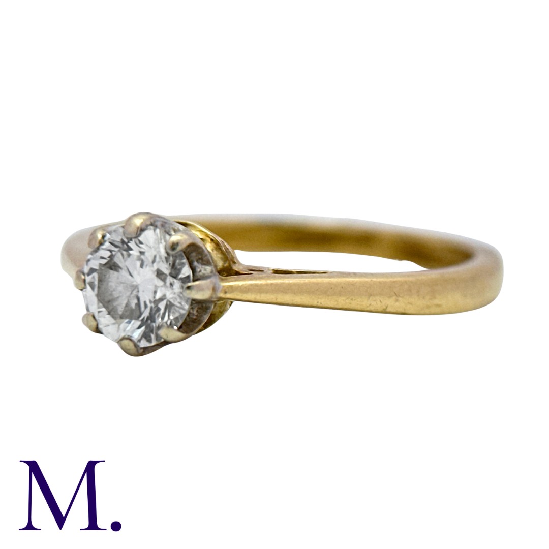 A Diamond Solitaire Ring in 18K yellow gold, set with a round brilliant diamond weighing - Image 2 of 3