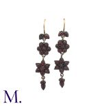 A Pair of Antique Garnet Earrings in silver and gold, with gold wires, taking the form of flower