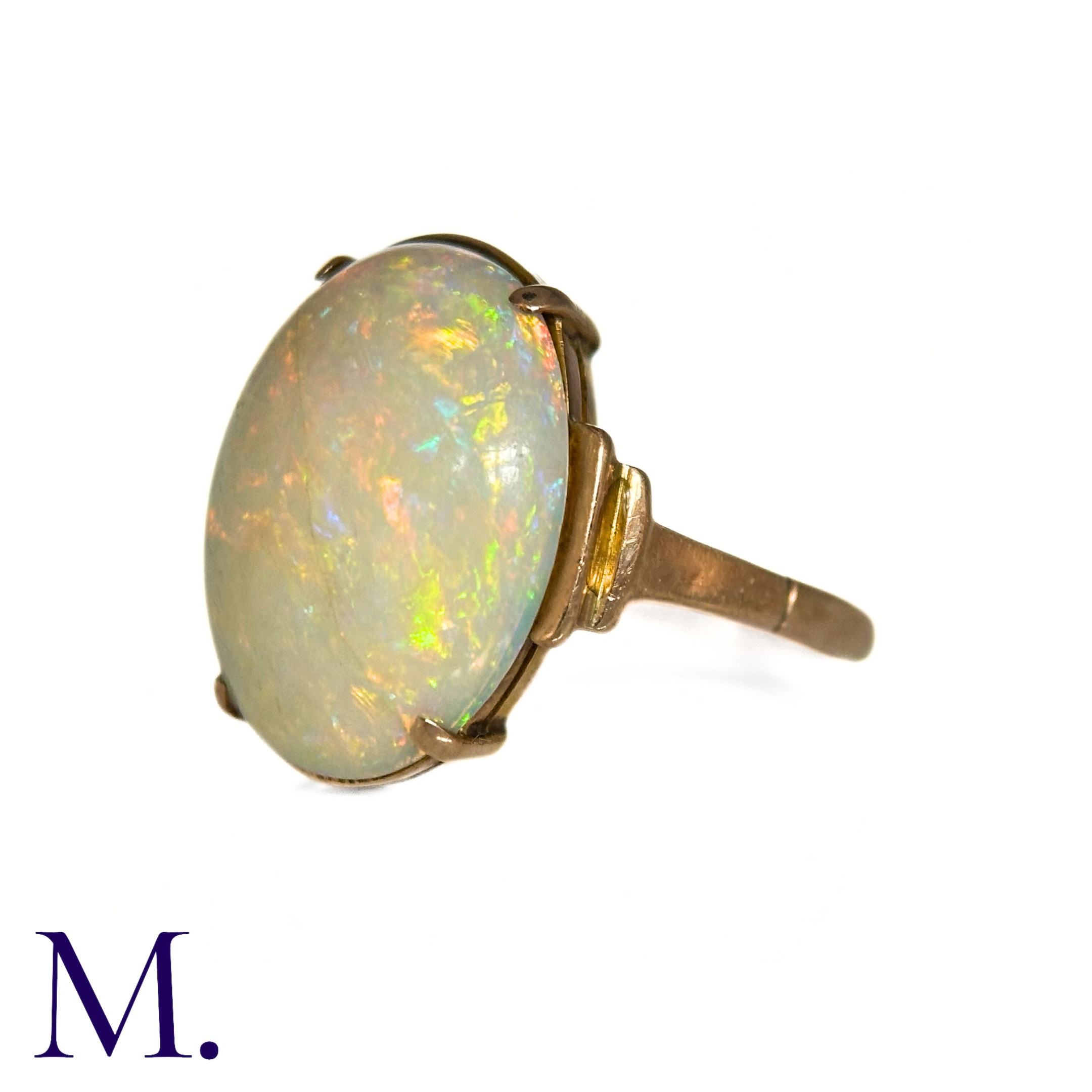 An Opal Ring in 9k yellow gold, set with a cabochon opal to stepped shoulders. Stamped 9ct. Size: - Image 3 of 7