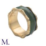 A Nephrite and Gold Ring in 14K yellow gold. The continuous nephrite band encircles the band with