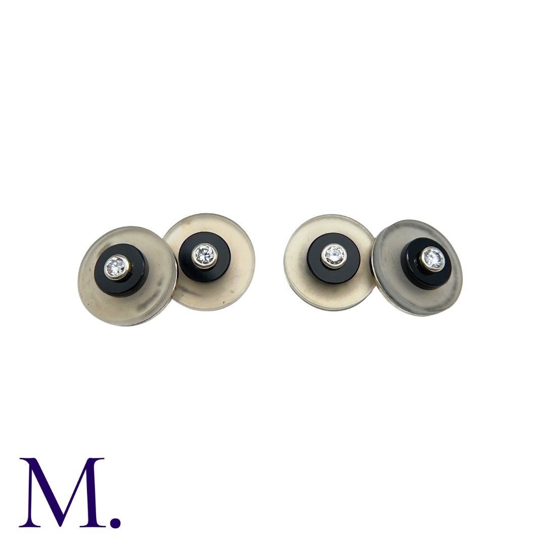 A Pair of Onyx, Crystal & Diamond Cufflinks in 18K white gold, with each crystal disc inlaid with