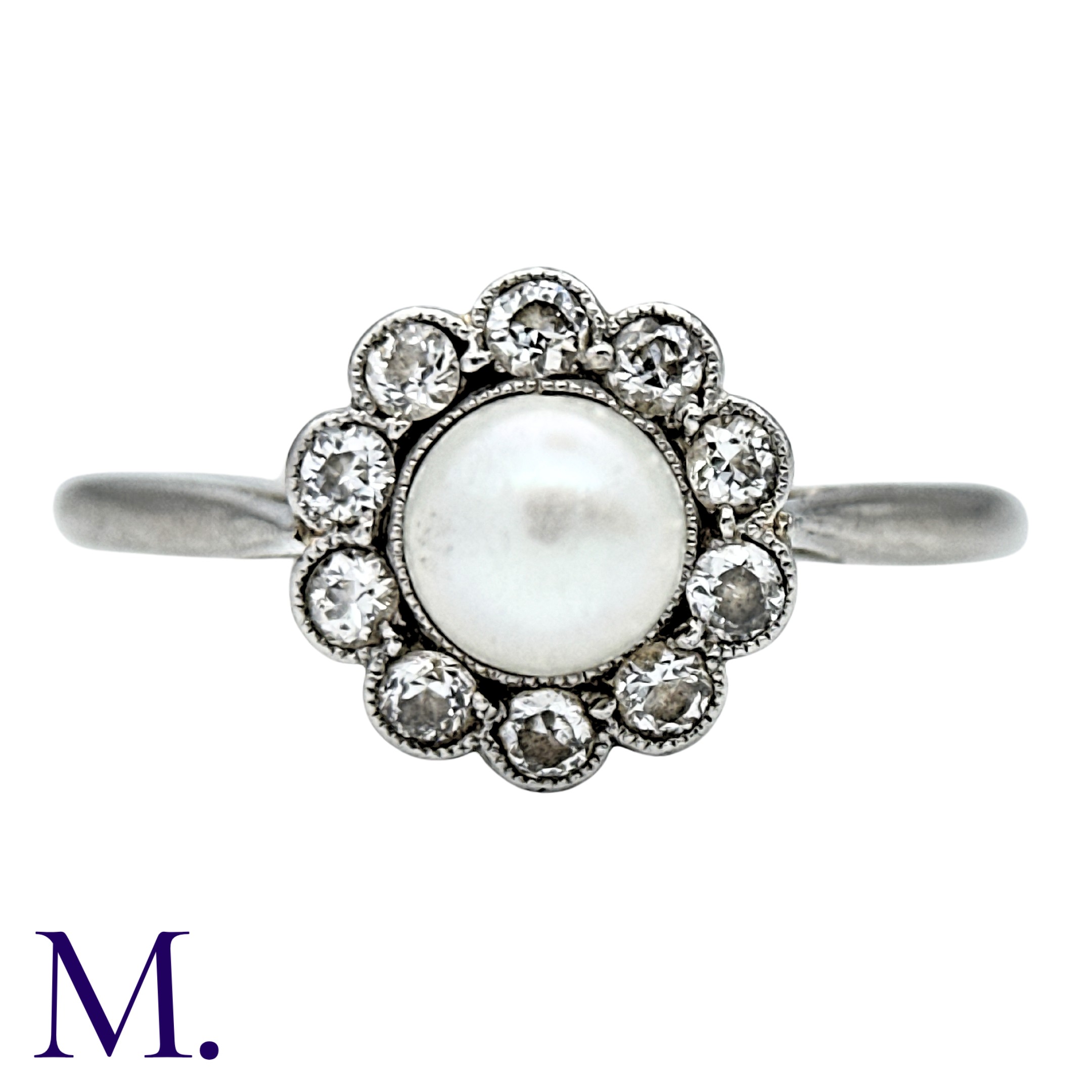 A Pearl And Diamond Cluster Ring in 18k white gold and platinum, set with a principal pearl of