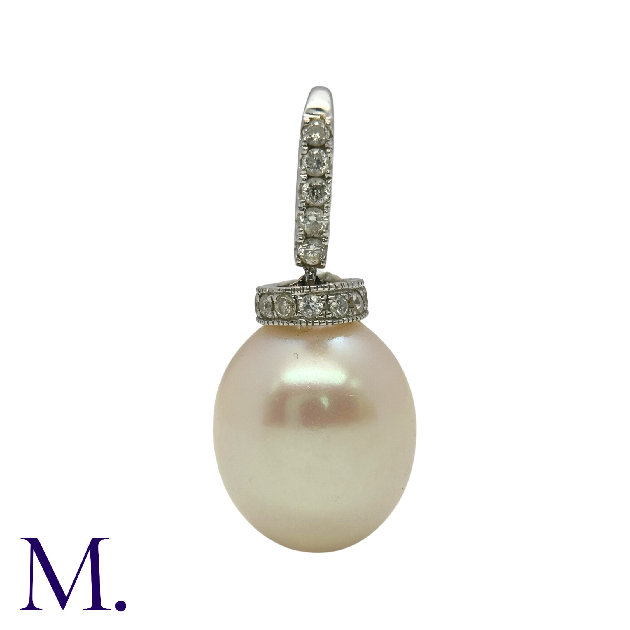 A Diamond and Pearl Drop Pendant in 18K white gold, set with an oval cream pearl with pink