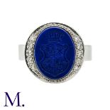 A Lapis Lazuli and Diamond Signet Ring set in 18K white gold, with carved intaglio in lapis lazuli