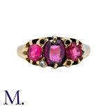An Antique 3-Stone Garnet/Ruby Ring in 18ct yellow gold, set with an oval-cut garnet to the centre