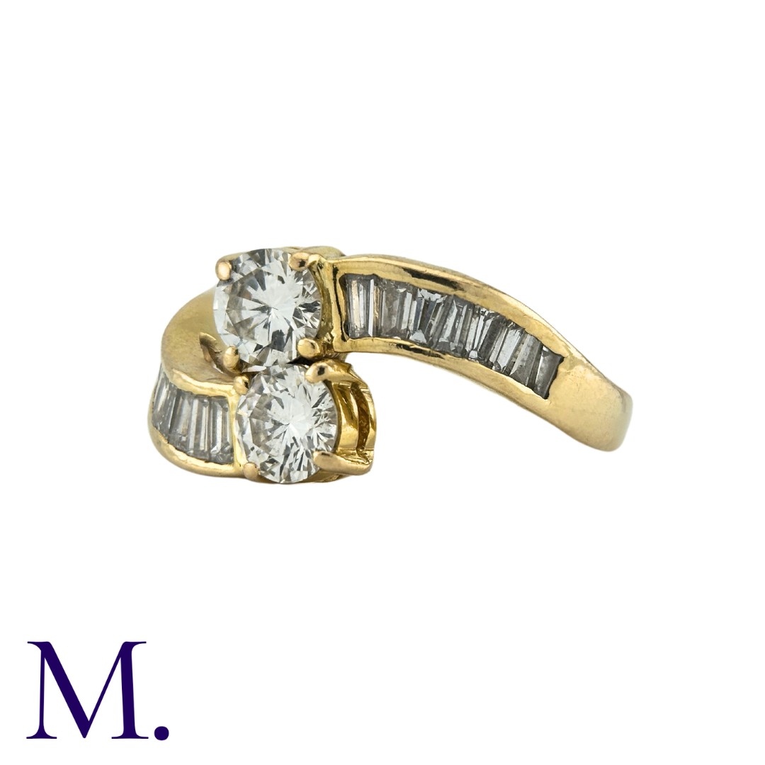 A Diamond Crossover Ring in 18K yellow gold, set with two round cut diamonds weighing - Bild 2 aus 2