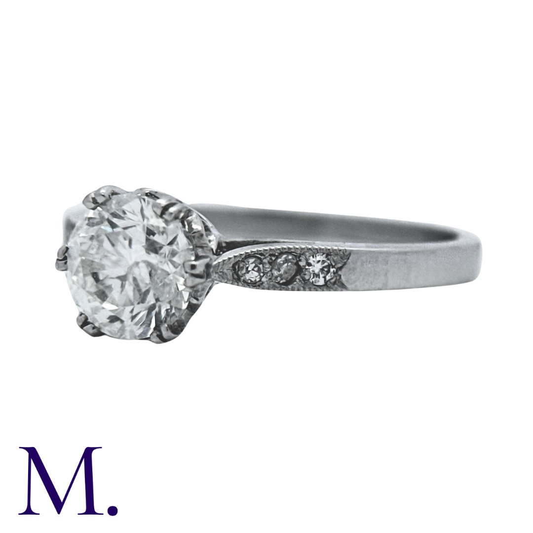 A Diamond Ring in white gold, set with a round brilliant cut diamond to the centre weighing - Image 2 of 4