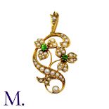 A Demantoid Garnet And Pearl Pendant in 15k yellow gold, the foliate and scrolling motif set with