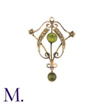 A Peridot and Pearl Pendant in 9K yellow gold, set with two round cut peridots and pearl accents.