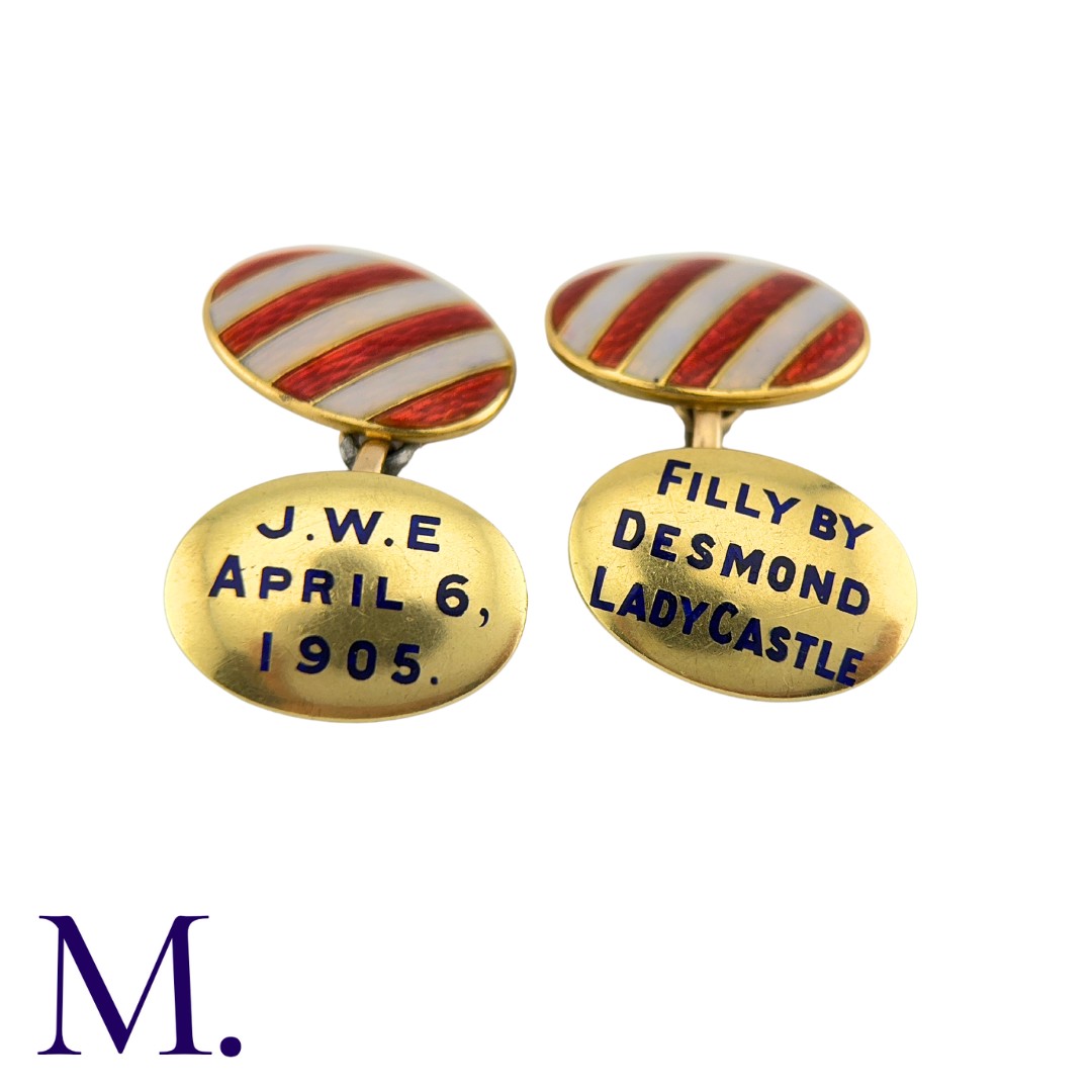 A Pair of Enamel Cufflinks in 9K yellow gold with enamel red and white stripes to one face and