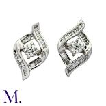 A Pair of Diamond Earrings in 18K white gold, each set with a round brilliant cut diamond of