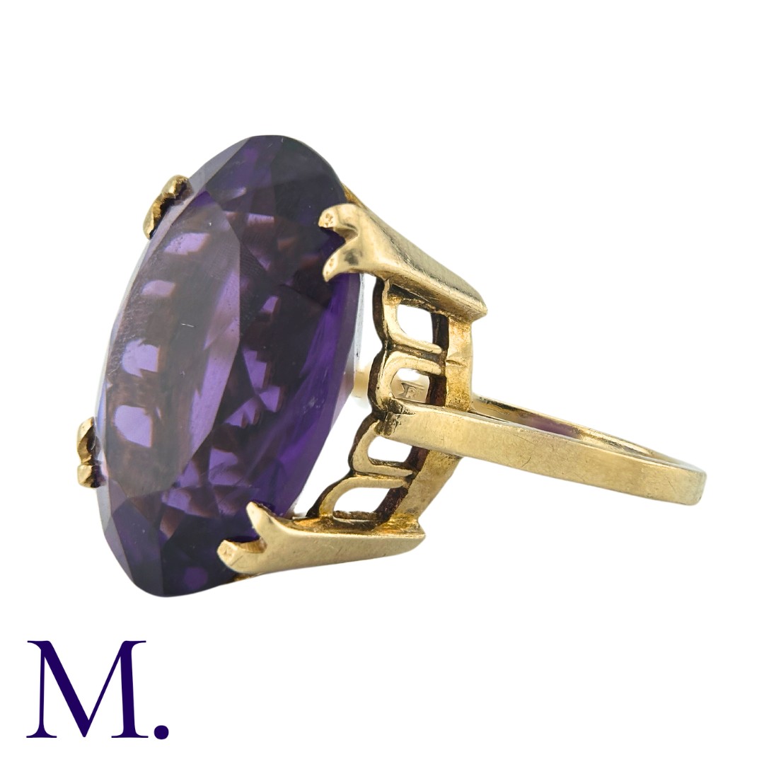 A Large Amethyst Ring in yellow gold, set with an oval cut amethyst weighing approximately 12.5ct. - Image 2 of 3
