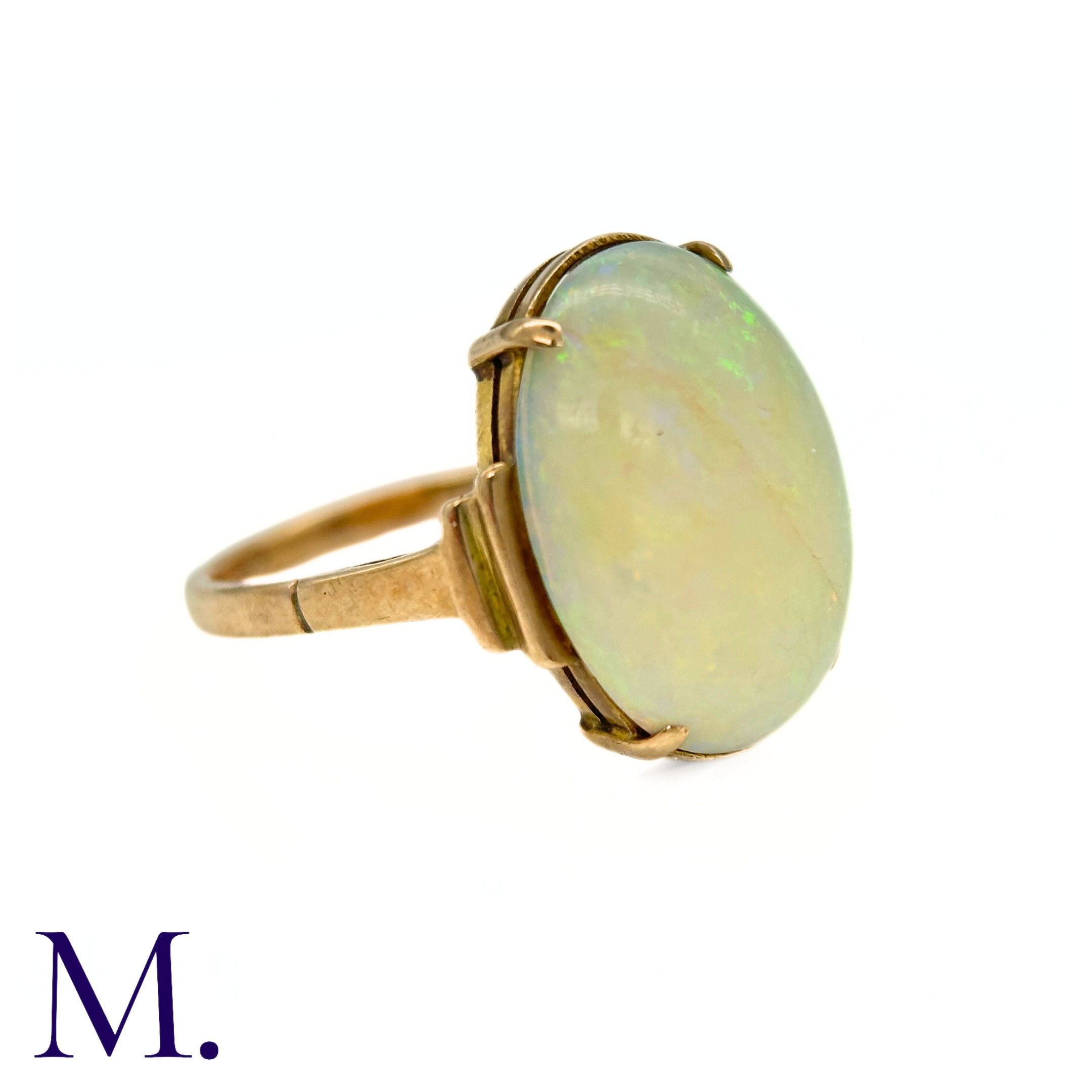 An Opal Ring in 9k yellow gold, set with a cabochon opal to stepped shoulders. Stamped 9ct. Size: - Image 5 of 7