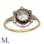 An Antique Ruby and Diamond Target Ring in 18K yellow gold, set with an old cut diamond to the