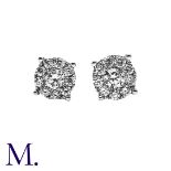 A Pair of Diamond Cluster Studs in 18ct white gold, each set with a single diamond to the centre and