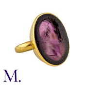 An Antique Signet Ring from a Private Collection in yellow gold with a purple glass intaglio